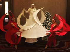 three women dressed in red and white are posing with their hands on their hipss