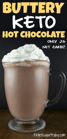 a glass mug filled with hot chocolate, whipped cream and buttery keto on top