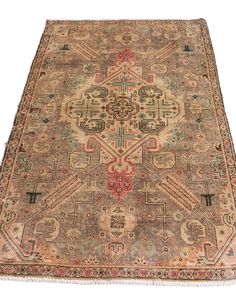 an antique rug with many different colors and designs on the carpet is shown in full view