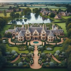 an aerial view of a large mansion surrounded by trees