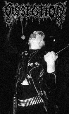 an image of a man with his mouth open in front of the camera, holding a microphone