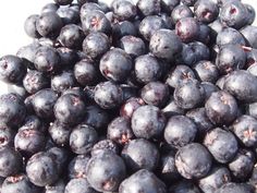 blueberries are piled on top of each other