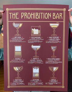 a woman holding up a sign with instructions on how to drink the prohibition bar in front of her