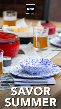 a table topped with plates and bowls filled with food next to glasses on top of each other