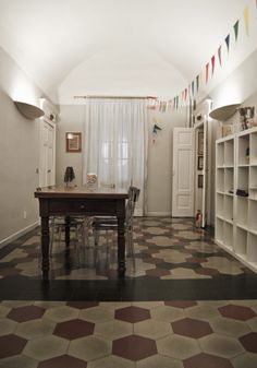 a room with a table and chairs in it