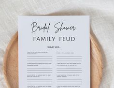 a printable bridal shower game on a wooden platter with white linens