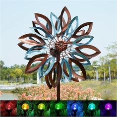 a colorful metal flower on top of a pole