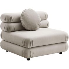 a white chair with pillows on top of it