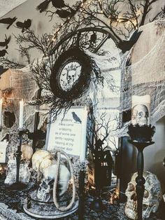 a table topped with halloween decorations and candles