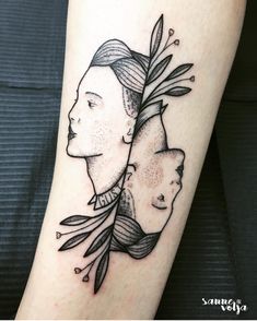 a woman's arm with an arrow and two women on it, both in black ink