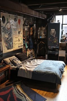 a bed room with a neatly made bed and lots of clutter on the walls