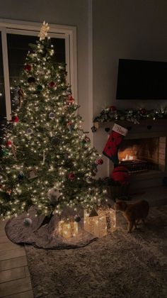 a christmas tree is lit up in the living room