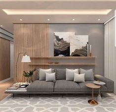 a living room with grey couches and white rugs on the floor in front of a wooden shelf