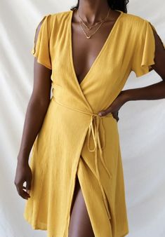 Celebrate the day with this flirty honey yellow wrap dress. Made of a gauzy rayon material, fully lined & finished with an adjustable waist tie sash. 75% Rayon / 20% Nylon / 5% Spandex Made In Vietnam Yellow Wrap Dress, Lulus White Dress, Blue Lace Mini Dress, Mustard Yellow Dresses, Ruffle Bodycon Dress, Mock Neck Sweater Dress, Honey Yellow, Wrap Dress Short, Long Sleeve Wrap Dress