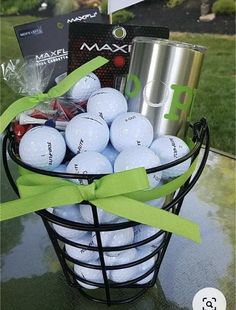 a basket filled with golf balls and a cup