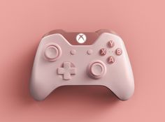 a close up of a nintendo wii controller on a pink background with no people around it