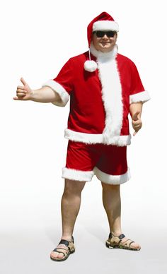 a man dressed up like santa clause giving the thumbs up sign while wearing sunglasses and a santa suit