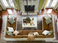 an overhead view of a living room with couches and tables