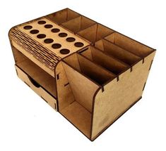 an open cardboard box with compartments for pens and pencils