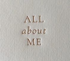 the words all about me written in brown ink