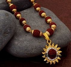 Handcrafted rudraksh Surya sun necklace with gold chain for unisex best for daily wear gives positive vibes and strength. The unique rudraksh sun surya necklace is chemical free skin friendly free size best for both men and women. Vintagebharat creation is dedicated to make unique designs this is one of those it's a perfect gift for your near and loved ones. The necklace is embedded with rudraksh beads and artificial diamonds that enhances it's charm. Shiva Design, Shiva Pendant, Sun Necklace, Boys Jewelry, Gold Ring Designs, Jewelry Design Earrings