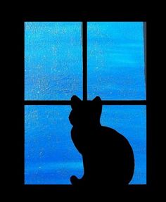 the silhouette of a cat sitting in front of a window looking out at blue water