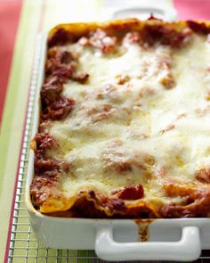 a casserole dish with meat, cheese and sauce