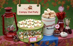 there are many desserts on the table and in front of it is an owl party sign