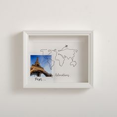 a white frame with a picture of the eiffel tower in paris on it