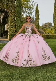 This Vizcaya by Morilee quinceaera ball gown (style 89435) is a timeless masterpiece. Bold, contrasting floral embroidery in a romantic design cascades down the voluminous skirt of classic tulle, creating a truly striking look. Pops of crystal beading add a touch of dazzling sparkle, making you shine on your special day. The structured bodice flatters your figure, and the matching bolero jacket adds a touch of sophistication. Choose from Black/Multi, Pink Ivy, and Blue/Multi to find the perfect Quinceanera Dresses With Intricate Embroidery And Fitted Bodice, Floral Embroidery Ball Gown For Debutante Ball, Quinceanera Ball Gown With Intricate Embroidery, Quinceanera Gown With Intricate Embroidery, Embroidered Ball Gown With Fitted Bodice For Quinceanera, Quinceanera Ball Gown With Floral Embroidery And Fitted Bodice, Quinceanera Gown With Floral Embroidery And Fitted Bodice, Gown With Floral Embroidery And Fitted Bodice For Quinceanera, Fitted Bodice Gown With Floral Embroidery For Quinceanera