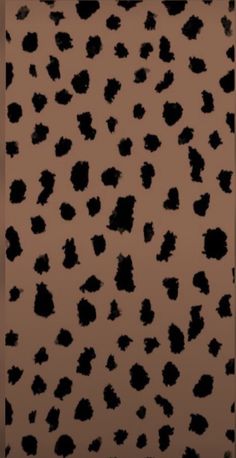 an animal print background with black spots