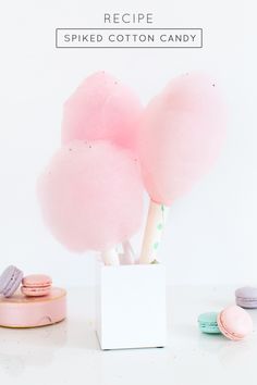 pink cotton candy in a white box with macaroni and cheese on the side