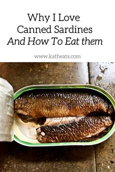 two sardines in a container with plastic wrapper and water on the floor