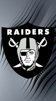 the oakland football team logo is shown in black and white on a dark gray background