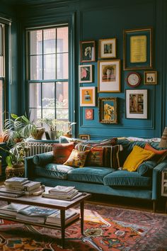 a living room filled with lots of furniture and pictures on the wall next to windows