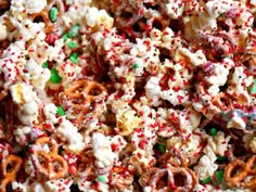 a bowl full of candy caned popcorn with sprinkles