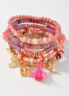 Add a touch of whimsy to your accessory game with our Beaded Charm & Shell Bracelet Set. Each bracelet features a unique assortment of colorful beads and charming puka shells. Perfect for those who like to mix and match for a playful and fun look. Bohemian Multicolor Charm Bracelet For Friendship, Multicolor Bohemian Charm Bracelet For Friendship, Bohemian Pink Beaded Bracelets For Vacation, Pink Heishi Beads Friendship Bracelets For Vacation, Adjustable Beaded Bracelets With Charms For Beach, Bohemian Pink Beaded Charm Bracelet, Pink Heishi Beads Bracelets For Vacation, Pink Heishi Beads Vacation Bracelets, Bohemian Beach Bracelets With Charms