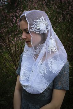 READY TO SHIP! PLEASE NOTE! Ships in 1-2 days. ONLY veils that state READY TO SHIP will ship in 1-2 days. Please order our custom veils on a separate order, or the entire order will ship within 2-3 weeks. A unique, handmade veil in an elegant, couture quality embroidered champagne mesh lace, with soft metallic gold accents/tiny sequins. Or white with silver accents. Please choose color at checkout. Includes a sewn-in clip. Measures about 46 X 21 inches. Evintage veils are handmade in limited pro Traditional White Veil, Lace Headwrap, Elegant Couture, Veil Mantilla, Elegant Veils, Latin Mass, Beautiful Veil, Chapel Veil, Silver Sequin