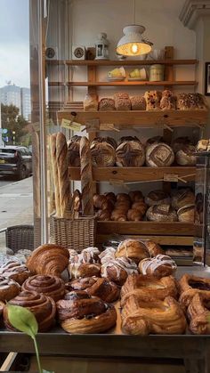 an assortment of breads and pastries on display