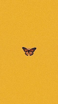 a butterfly flying in the sky with yellow background