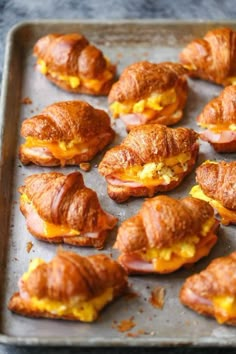 there are many croissants that have been made to look like breakfast sandwiches