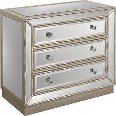 a mirrored dresser with three drawers and silver trimmings on the bottom, one drawer closed