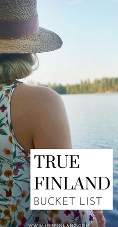 a woman wearing a hat looking out at the water with text overlay that reads true finland bucket list