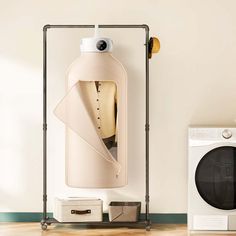 a water heater next to a washing machine and dryer in a white room