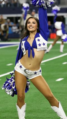 a cheerleader is dancing on the field