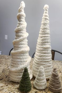 three different types of yarn sitting on top of a table next to eachother