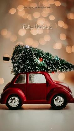 a small red car with a christmas tree on top