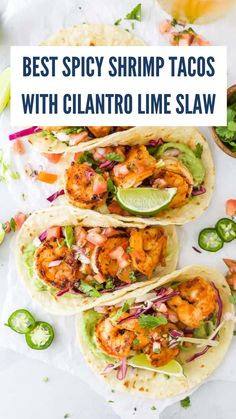 the best spicy shrimp tacos with cilantro lime slaw are on top of each other