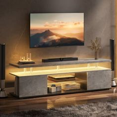 an entertainment center in a living room with a flat screen tv mounted on the wall