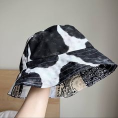 Handmade Reversible Bandanas&Cow Printed Bucket Hat SKU 1049 Size: Unisex One Size Fits All(will generally fit heads with a circumference of 21.5" to 23.5"). Fabric: -100% cotton cow printed duck cloth. -100% cotton high quality bandanas, brand new. -100% handmade. -The bucket hat is reversible and can be worn both ways. -Foldable and packable. -Machine washable.  -Brand new. Cow Print Bucket Hat, Crochet Winter Hats, Duck Cloth, Juicy Couture Charms, Hand Knit Hat, Slouch Hat, Handcrafted Accessories, Knit Beanie Hat, Cow Print